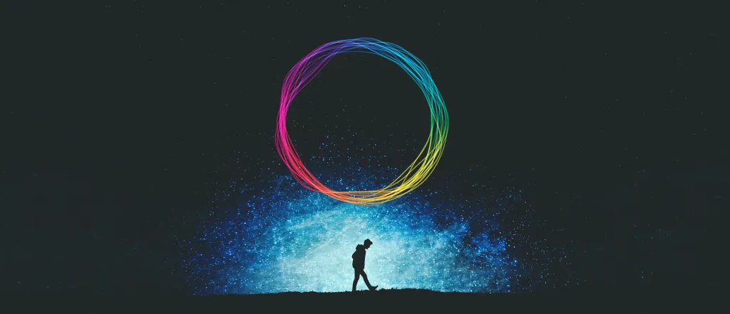 Person walking with neon lights in background to represent journey to self care.